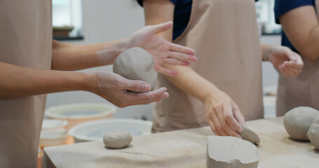 Kneading clay material before making pottery