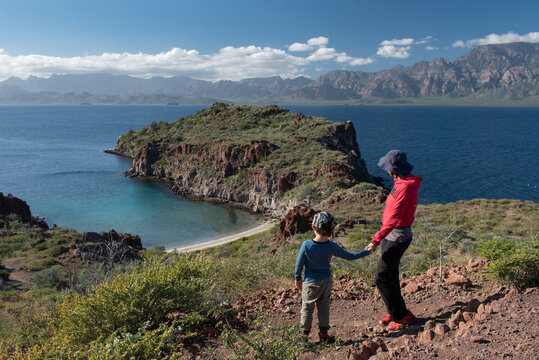 A woman and her son on a hill at Del Carmen Island in Loreto Bay