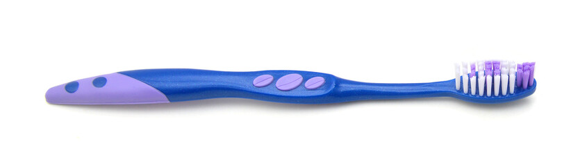 Close up of a blue toothbrush over white background