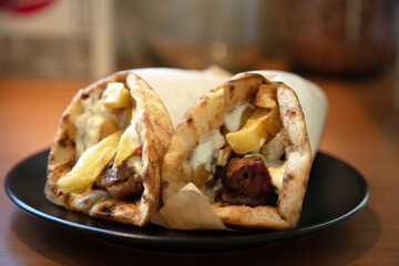 Gyro pita, shawarma, take away, street food. Traditional greek turkish meat food