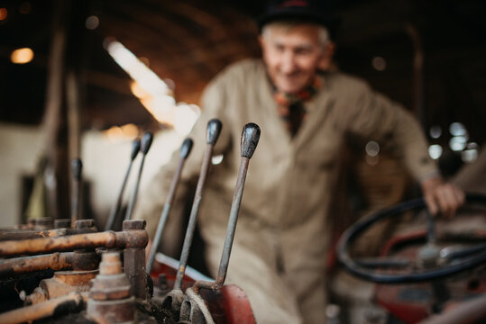Old and dirty excavator command closeup