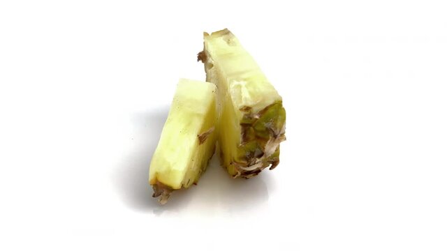 sliced baby pineapple isolated on white