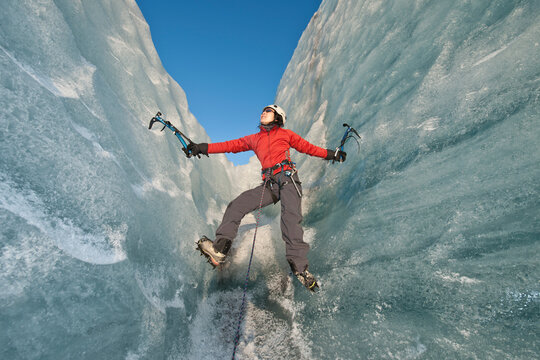 woman climbing on the Fjallsj&radic;&part;kull glacier in Iceland