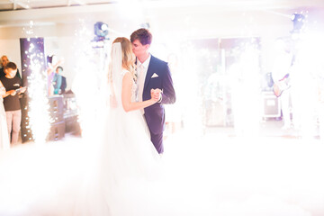 Beautiful wedding couple just married and dancing their first dance