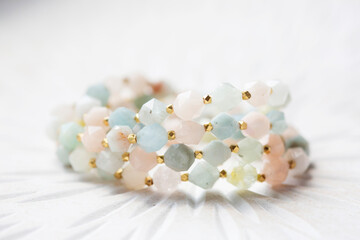 Cubic faceted morganite mineral stone beads bracelet on white background