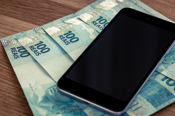 Telephone and Brazilian currency, Reais