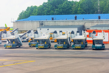 A row of gangways for boarding and alighting passengers from an airplane parked at the airport.