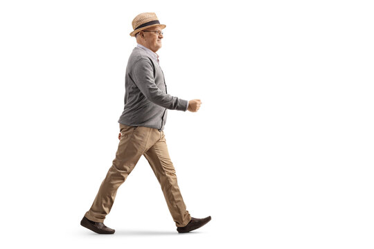 Full length profile shot of an elderly gentleman walking