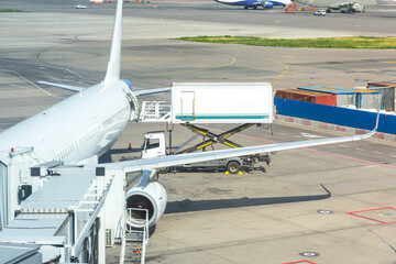 Loading food and food into the plane required for a commercial passenger flight.