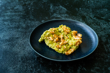 Mashed Avocado Puree Dessert with Walnut and Honey.