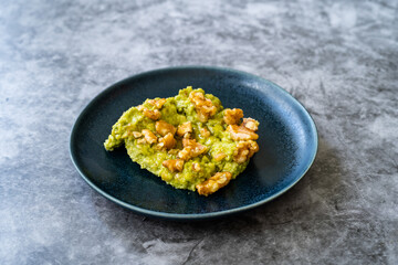 Mashed Avocado Puree Dessert with Walnut and Honey.