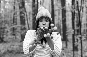 Woman blowing confetti off her hands