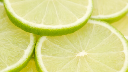juicy sliced lime and mint leaf top view