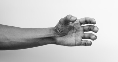 Hand holding something like a bottle, Black and white image.