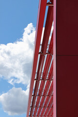 Decorative red steel construction. The metal framework at the roof of the building.