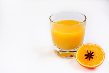 Glass of orange juice on a white background