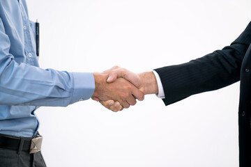 Business people shake hands when reaching a business agreement together.