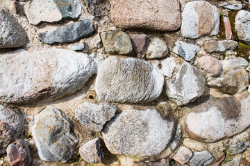 Ancient fortress stone wall. Natural background or texture.