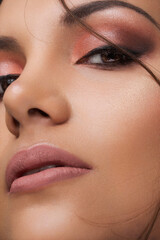 detail of a face with professional single-tone makeup and hair, studio