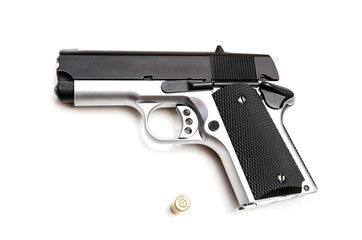 handgun and 9mm pistol bullet isolated on white background