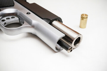 9mm pistol bullet and handgun isolated on white