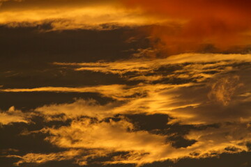 Colorful cloud patterns with golden hour light.