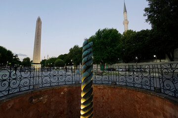 The ancients Serpent column and Obelisk of Theodosius, left, located at the Hippodrome square, are...