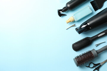 Composition with hairdresser accessories on blue background