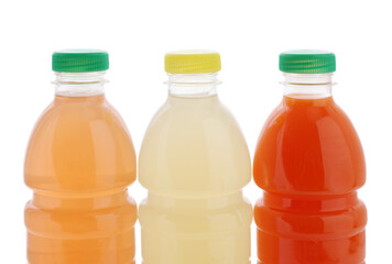 Three juice bottles isolated on white. Studio shot.	