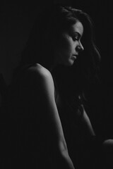 Obraz premium Portrait of a young girl on a dark background