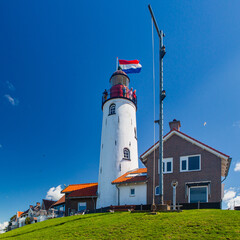 The lighthouse of Urk in the Netherlands. Urk is an old  fishing village that is visited by many tourists every year.
