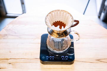 Barista preparing coffee with filter