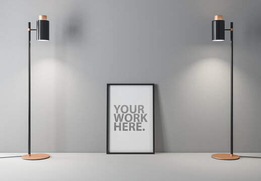Vertical Black Frame Mockup Standing on Gray Floor with Two Lamps