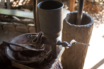 Coffee grinder and boiling water to brew coffee of the hill tribe people at Doi Inthanon National Park, Thailand