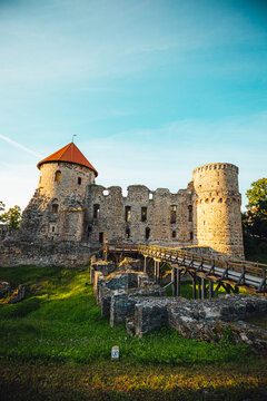 View on beautiful ruins of ancient Livonian castle in old town of Cesis, Latvia, warm sunset time.