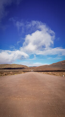 Road to the desert landscape with blue sky in Reunion Island
