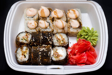 Hot fried Sushi Roll with salmon, eel, calf caviar and cheese. Sushi menu. Japanese food. Hot fried Sushi Roll