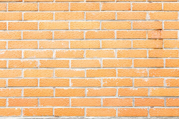 Textured orange brick wall. Background texture, close up view