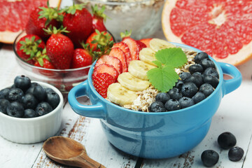 Healthy diet breakfast including cereal with berry and fruits	
