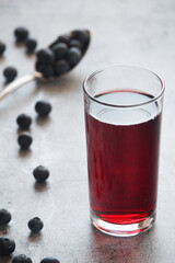 Fototapeta na wymiar A glass full of blueberry juice
