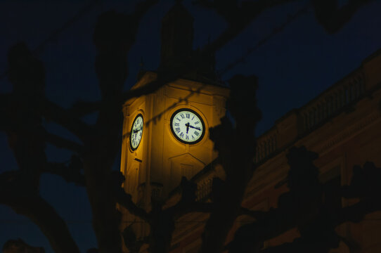 Beautiful clock tower at quarter past six. Autumn sunset