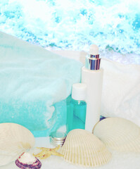 Sea spa composition with cotton towels, seashells, algae-based cosmetics. Relaxing and mineralizing treatment.  Summer and vacation spirit.