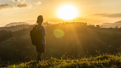 Boy walking in a beautiful sunset in brazil