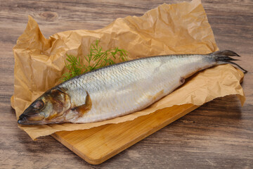 Salted herring over the wooden board