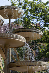 Image of a fountain in a summer park. Fountain in a park in a European city.