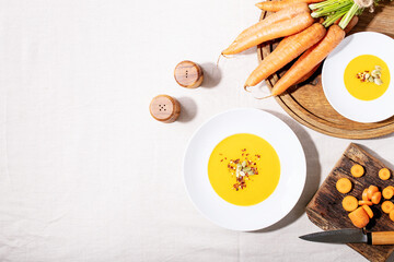 Carrot puree soup in ceramic plate