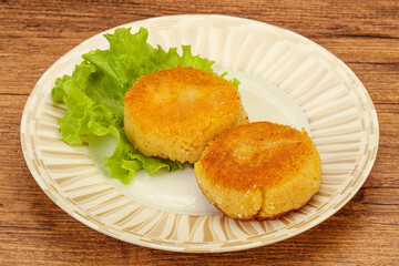 Vegan cuisine - Potato cutlet in the plate