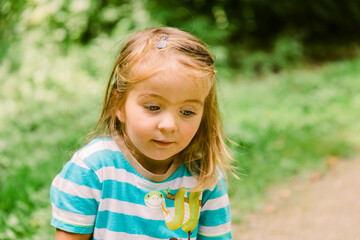 Toddler girl portrait in forest