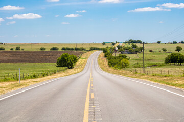 Summer or spring view of country road in Justin Texas