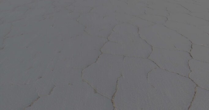 Hexagon Tiles in Uyuni Salt Flat at Sun Rise Travelling Aerial shot